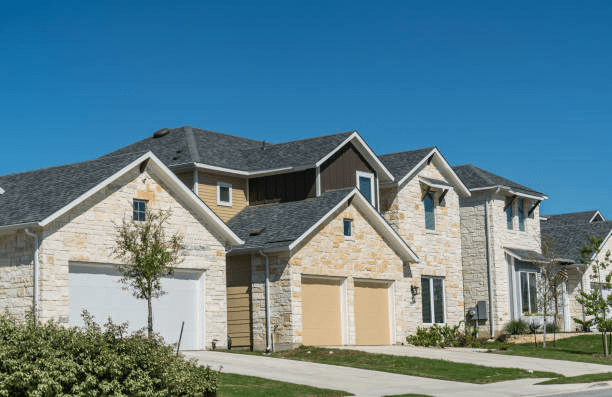 Recon Roofing crew working on a home in Leander, TX